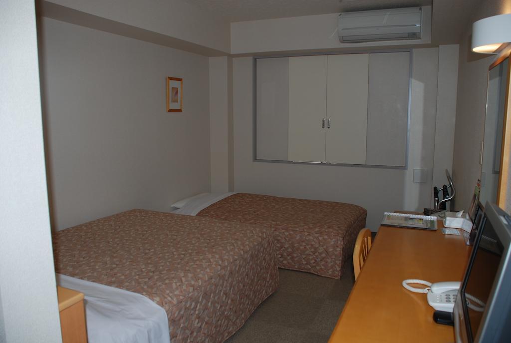 Best Inn Uozu Quarto foto